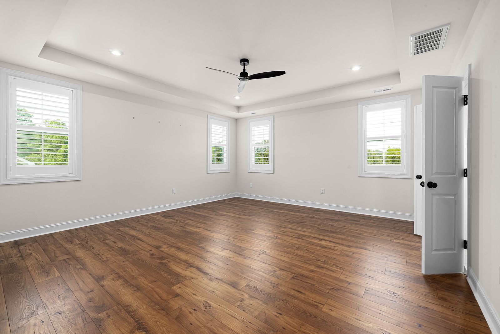 Empty apartment with wood floors, cleaned and ready for new tenants
