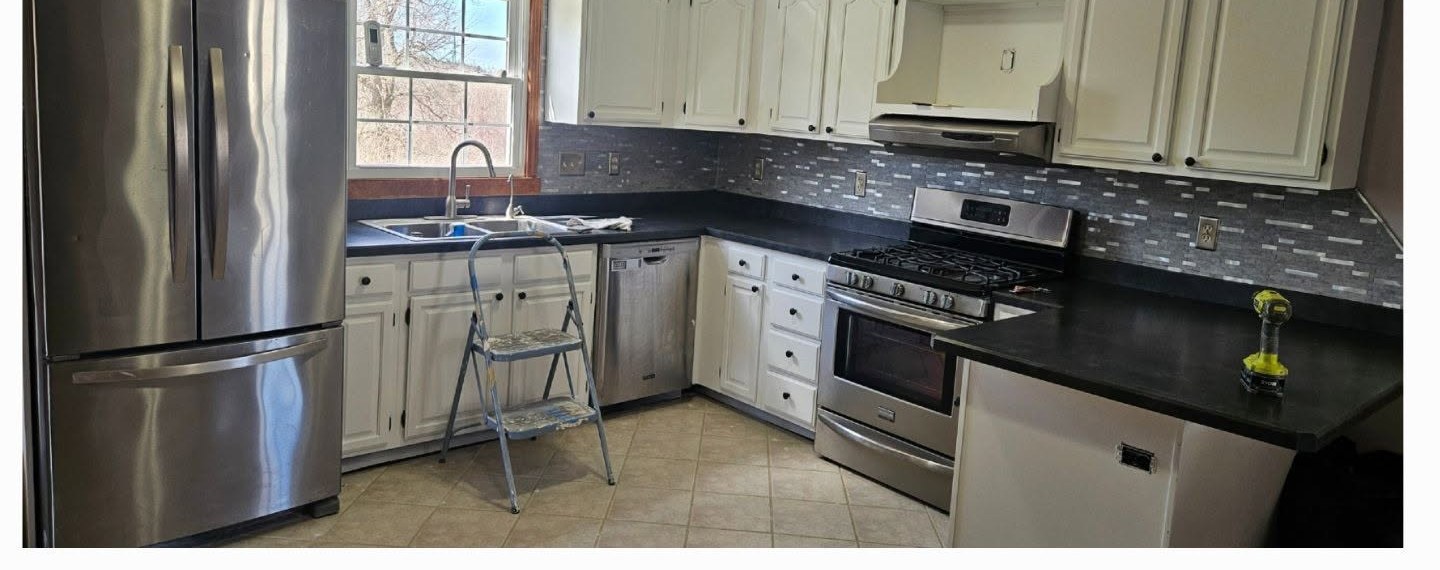 Kitchen cabinets after refinishing in white