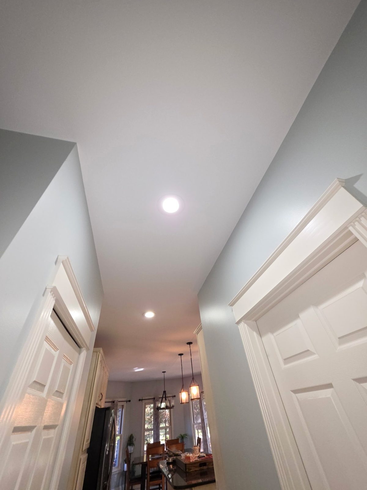 Hallway ceiling leading into the kitchen of a DeWitt, Michigan home, painted by Exit Strategies Property Solutions