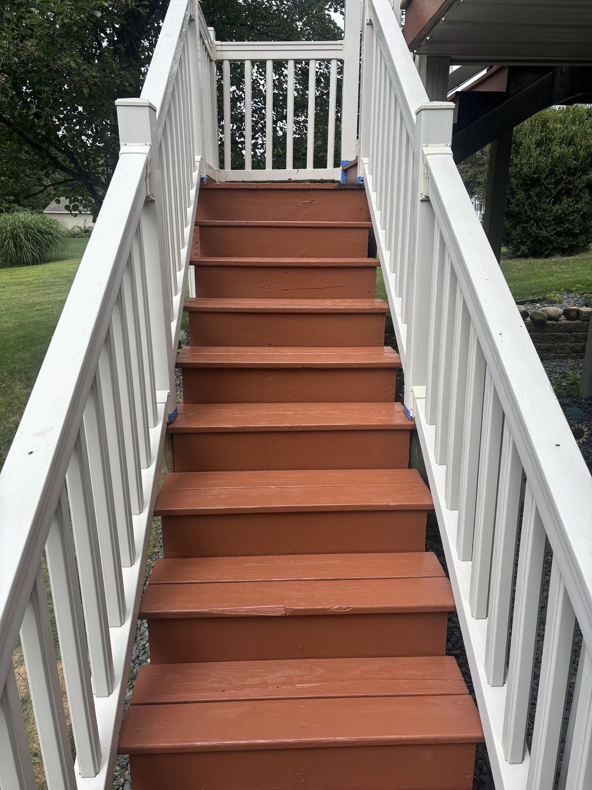 Deck stairs with fresh solid coating after refinishing