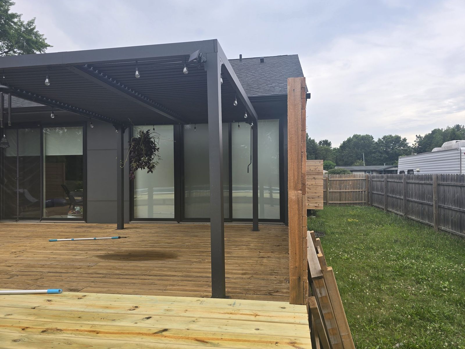 Wood deck with pergola and privacy screen on a Mid-Michigan property