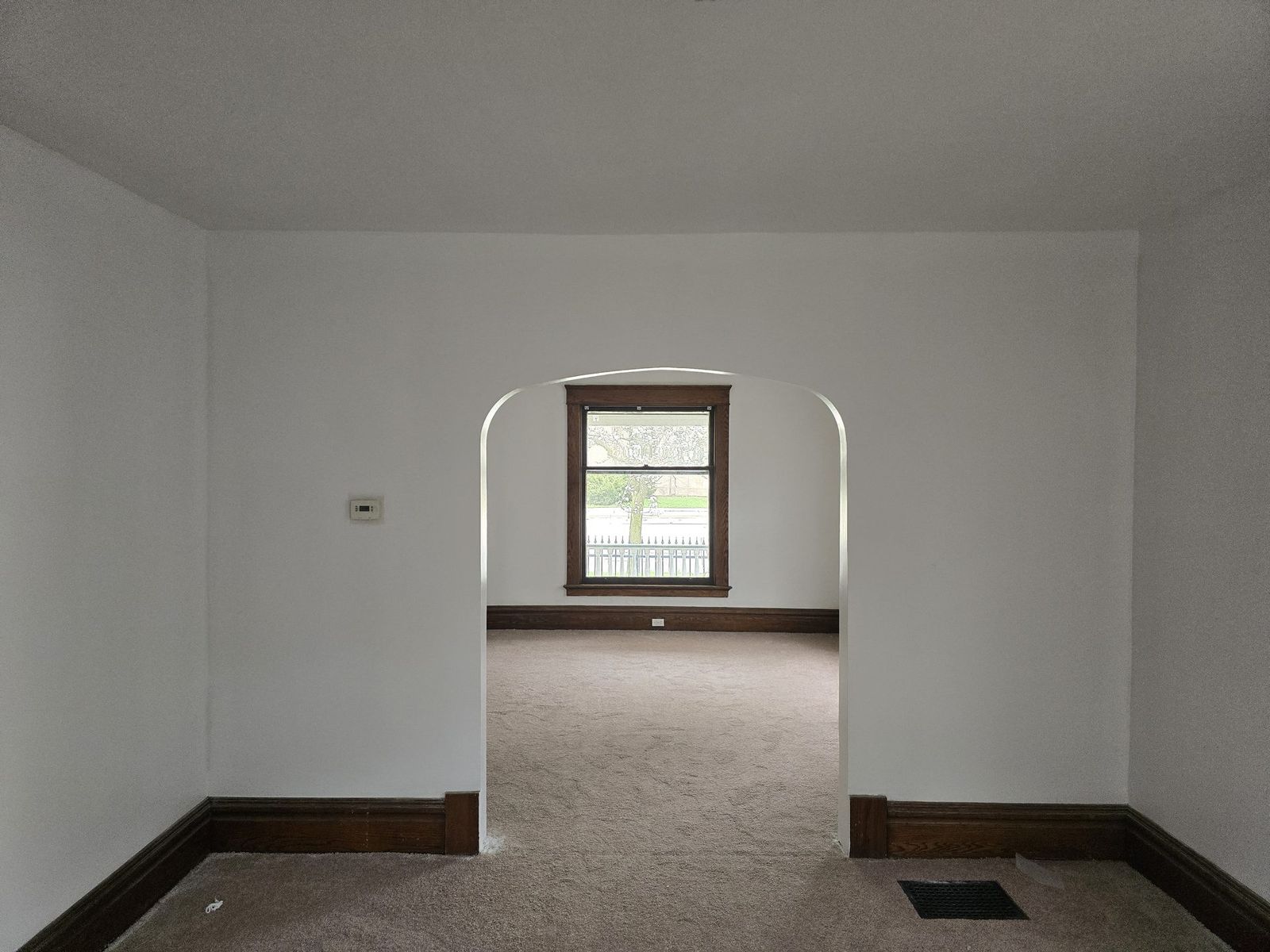 Freshly painted unit interior with arched opening, finished to a leasable standard