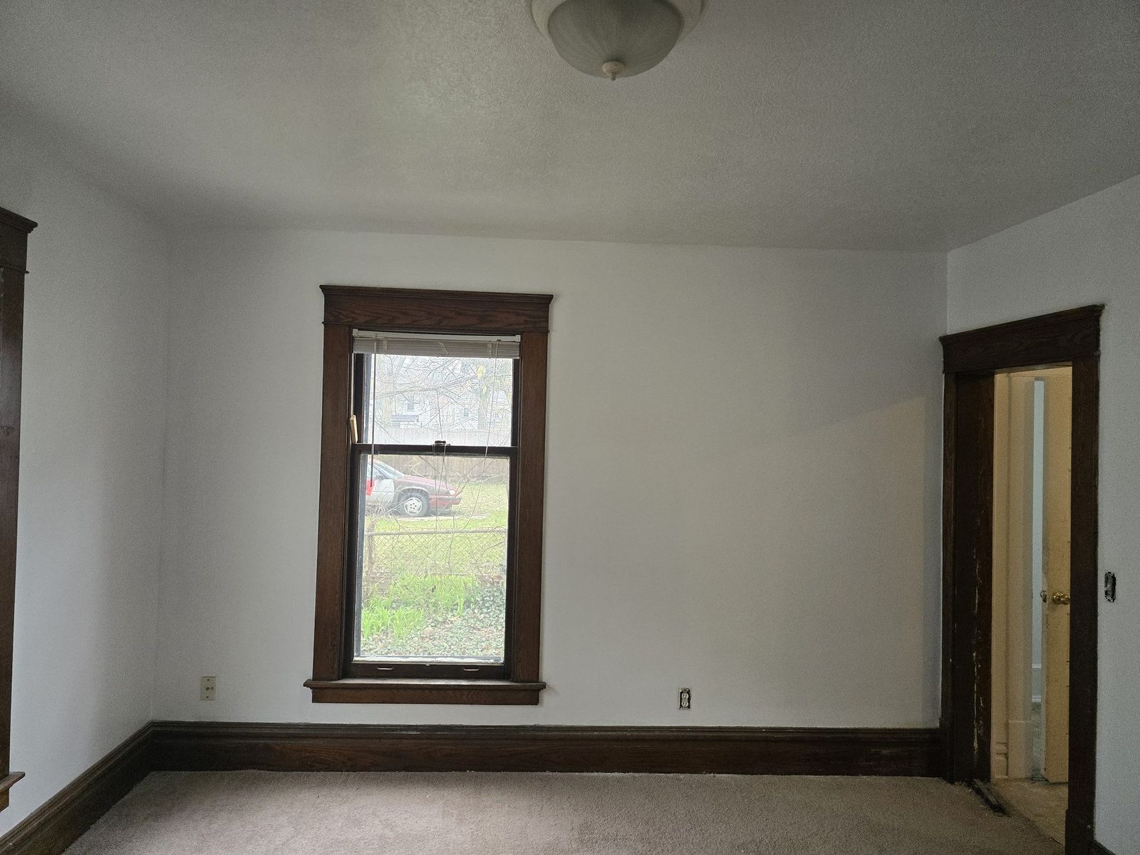 Freshly painted white interior entry room with dark trim