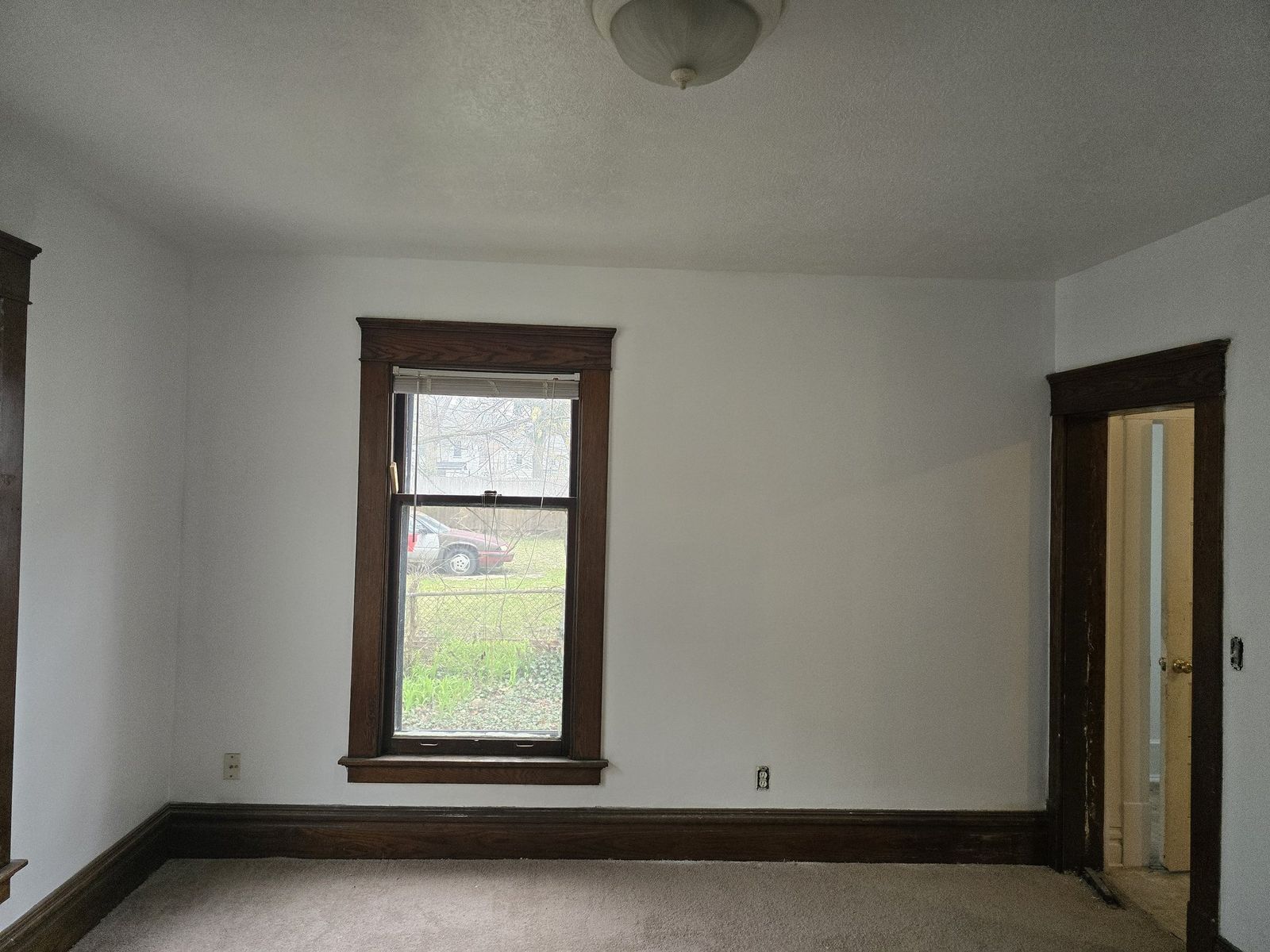 Finished vacant room with dark trim