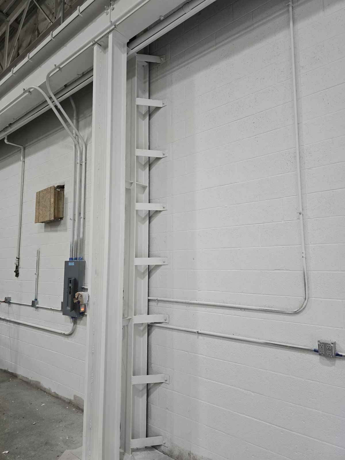 Coated warehouse wall, column and conduit